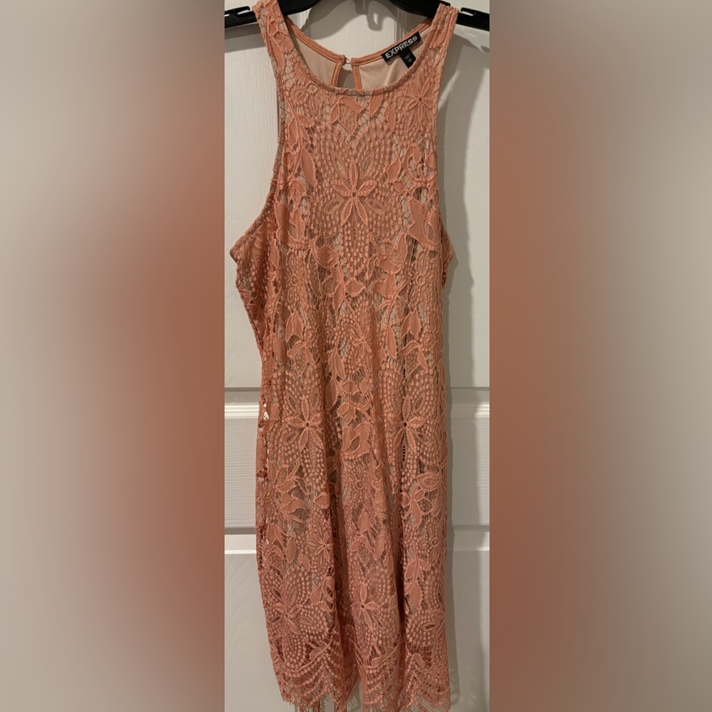 Express sleeveless lace dress, Fully lined. Single button closure in the back.